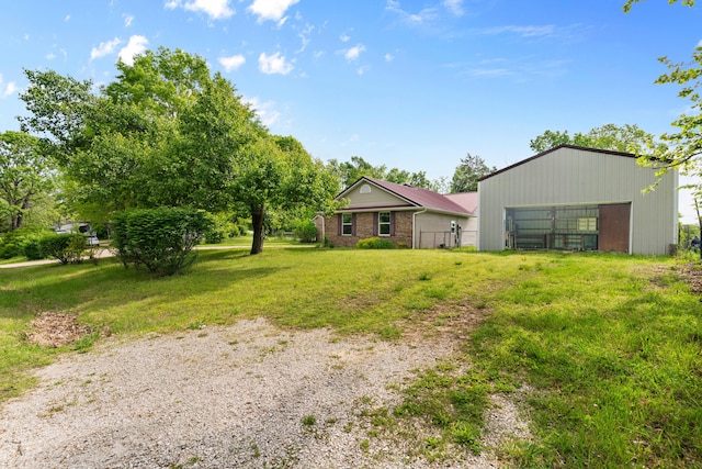 245 Country Hills Rd, Branson, MO 65616 - view of yard featuring an outbuilding and a garage