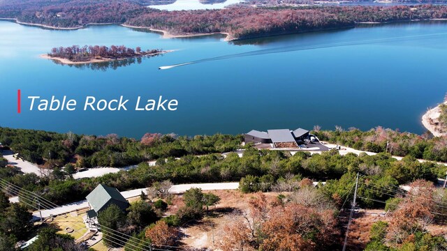 aerial view of a large body of water and a heavily wooded area
