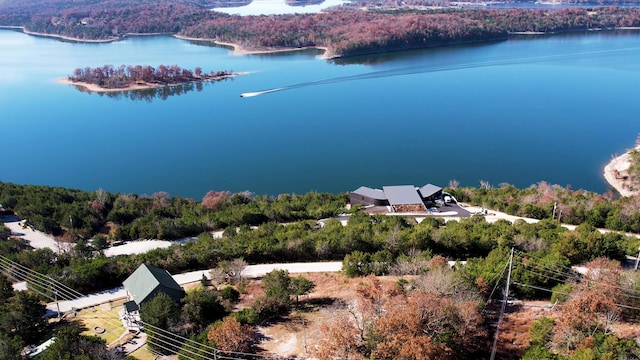 bird's eye view of a heavily wooded area and a large body of water