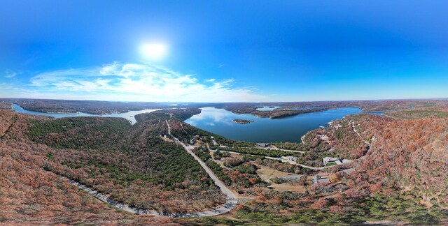 aerial view of a large body of water and a heavily wooded area