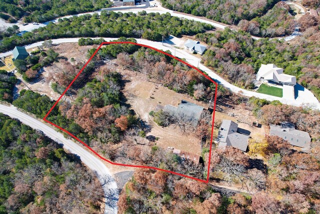 aerial view of property and surrounding area featuring property boundaries highlighted