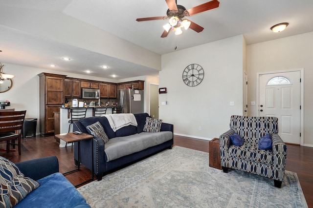 living room featuring ceiling fan, dark wood finished floors, baseboards, recessed lighting, and vaulted ceiling