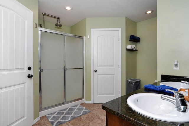 full bath with a stall shower, vanity, tile patterned floors, and recessed lighting