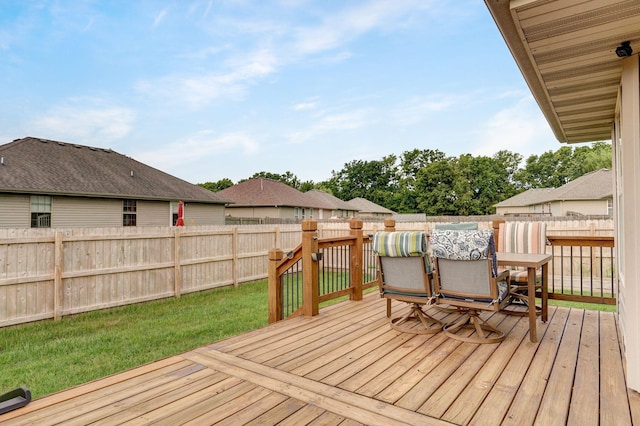 deck featuring a fenced backyard and outdoor dining space