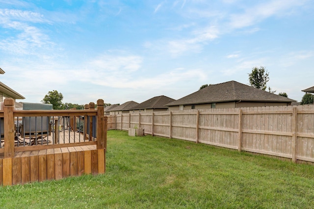 view of yard with a wooden deck