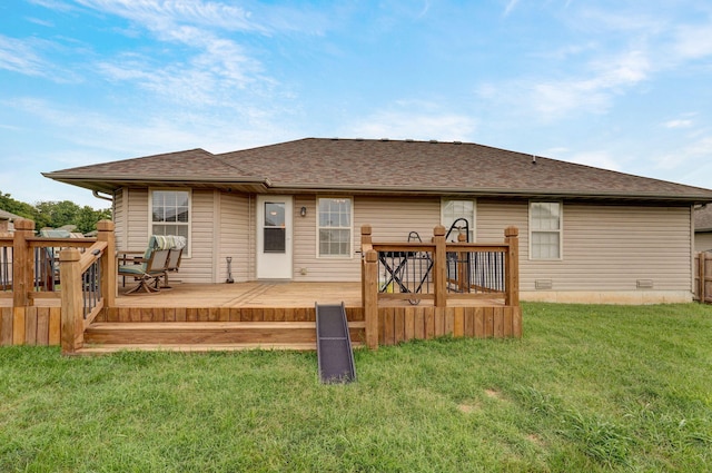 back of house featuring a wooden deck, a lawn, roof with shingles, and crawl space