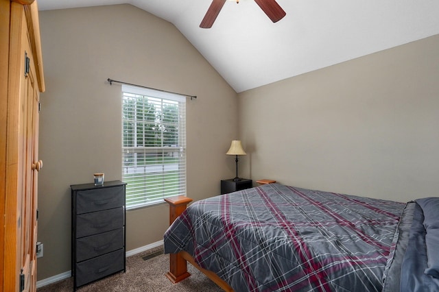 bedroom featuring lofted ceiling, dark colored carpet, baseboards, and ceiling fan