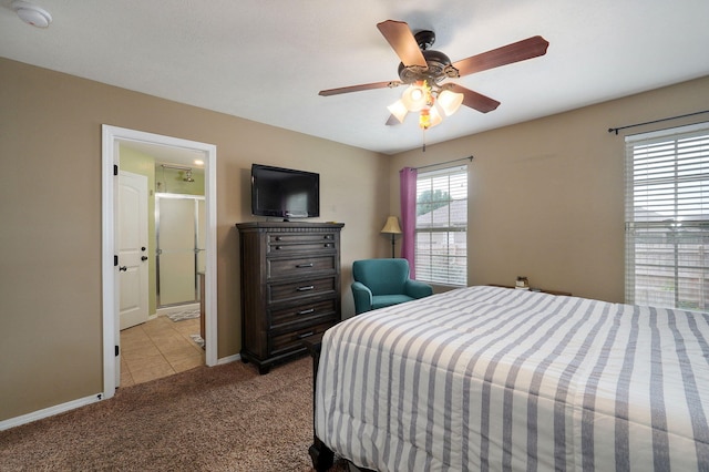 tiled bedroom featuring carpet, baseboards, a ceiling fan, and connected bathroom