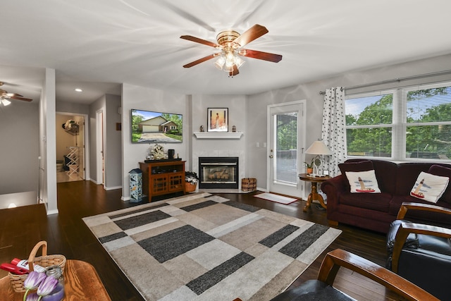 138 Canyon Forest Cir, Kimberling City, MO 65686 - living room with ceiling fan, a tiled fireplace, wood finished floors, baseboards, and recessed lighting