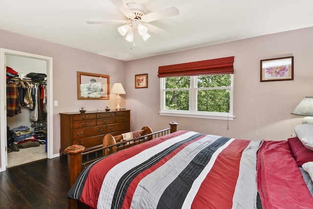 138 Canyon Forest Cir, Kimberling City, MO 65686 - bedroom with dark wood finished floors, a spacious closet, a closet, ceiling fan, and baseboards