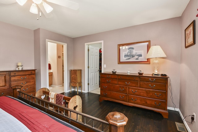138 Canyon Forest Cir, Kimberling City, MO 65686 - bedroom featuring dark wood finished floors, baseboards, connected bathroom, and ceiling fan