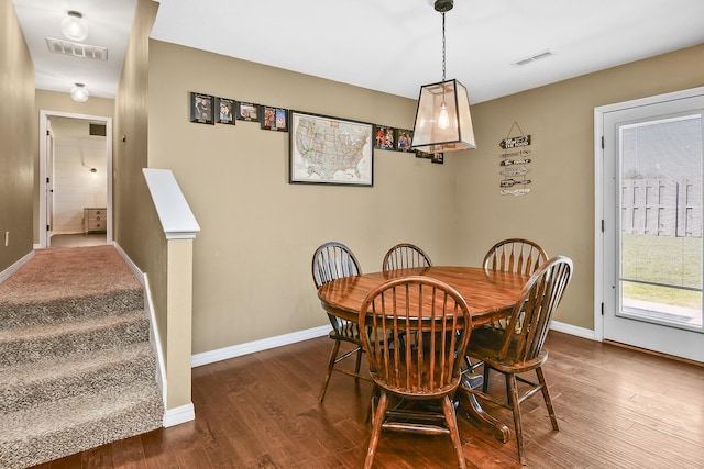 2107 S Gristmill Ct, Ozark, MO 65721 - dining area with dark wood-style flooring and baseboards