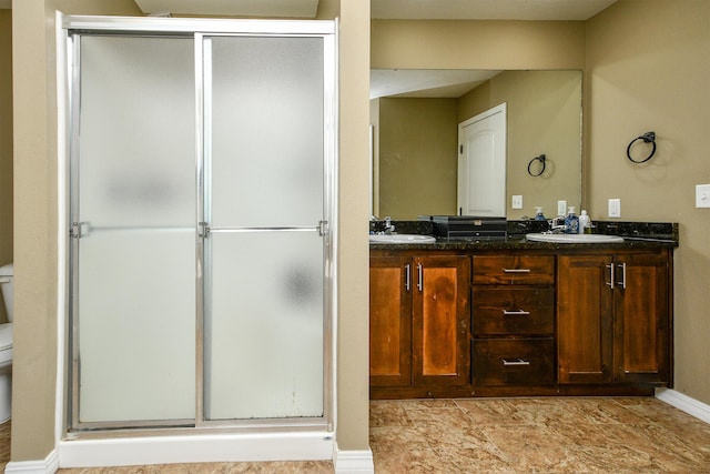 2107 S Gristmill Ct, Ozark, MO 65721 - full bath featuring a stall shower, double vanity, baseboards, and toilet