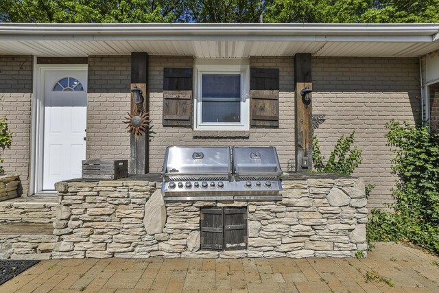 view of patio with exterior kitchen and grilling area