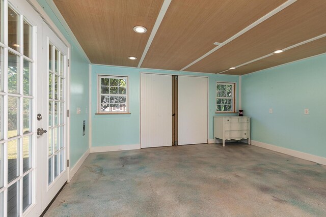 interior space featuring wooden ceiling, recessed lighting, french doors, and baseboards