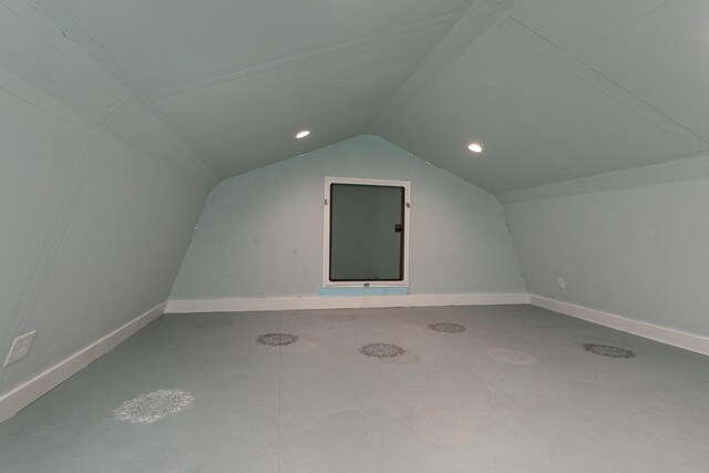 bonus room featuring vaulted ceiling, baseboards, and recessed lighting