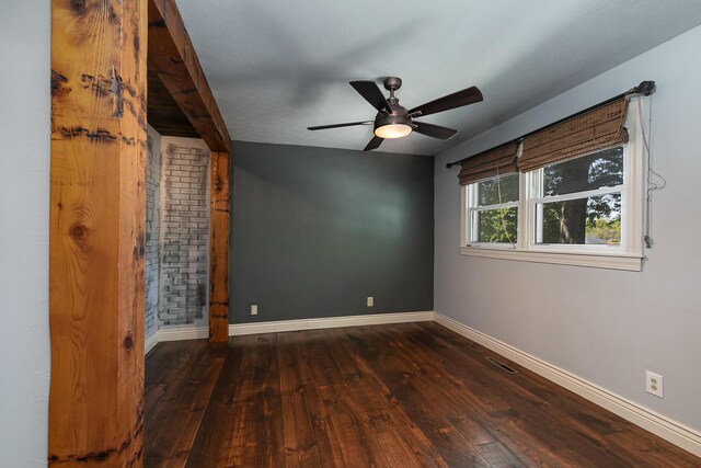empty room featuring hardwood / wood-style floors, baseboards, and ceiling fan