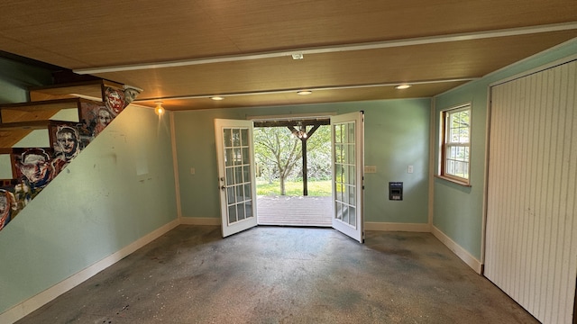 doorway to outside featuring baseboards and french doors