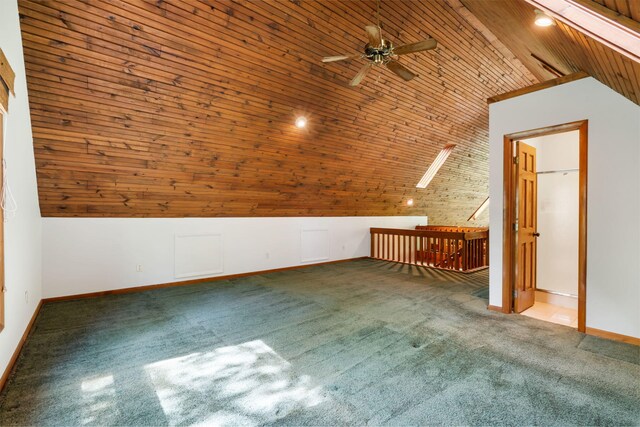 bonus room with vaulted ceiling, ceiling fan, carpet flooring, wooden ceiling, and baseboards