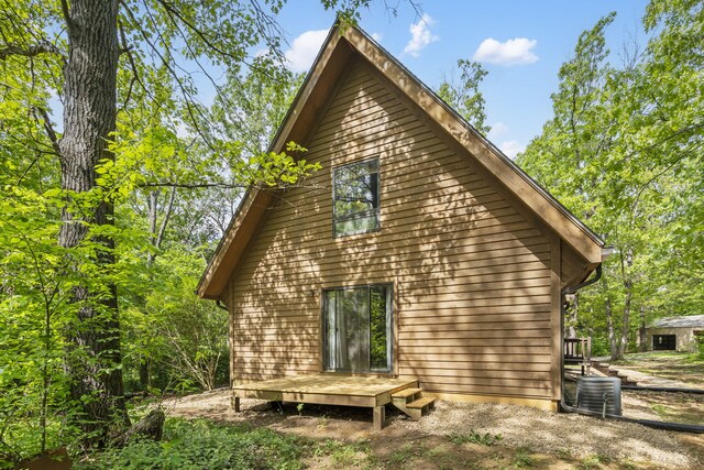 view of property exterior featuring a deck