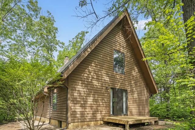 view of side of property with a chimney
