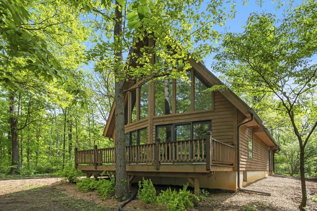 view of side of property with a deck