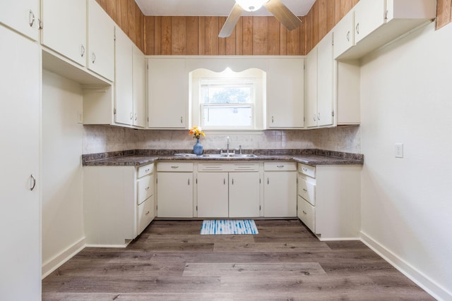 901 W Poplar St, Springfield, MO 65802 - kitchen featuring a sink, dark countertops, and tasteful backsplash