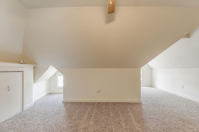 901 W Poplar St, Springfield, MO 65802 - additional living space with carpet flooring, vaulted ceiling, baseboards, and ceiling fan