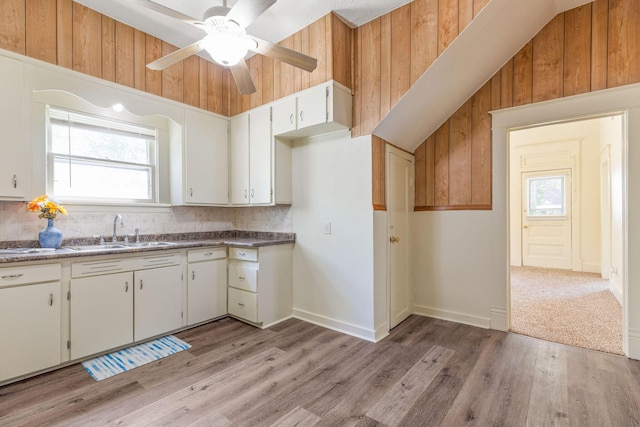 901 W Poplar St, Springfield, MO 65802 - kitchen with a sink, a ceiling fan, light wood-style flooring, backsplash, and white cabinets