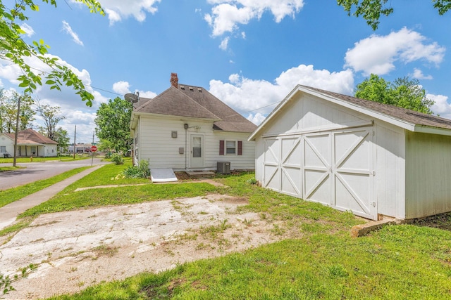 901 W Poplar St, Springfield, MO 65802 - back of house with a yard and cooling unit