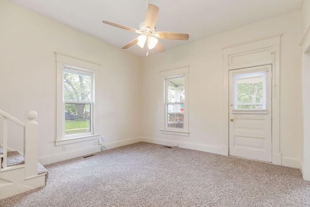 901 W Poplar St, Springfield, MO 65802 - carpeted entryway featuring a ceiling fan, baseboards, and stairway