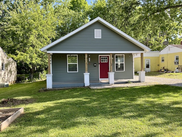 2016 W Olive St, Springfield, MO 65802 - bungalow-style house featuring covered porch, a front lawn, and cooling unit