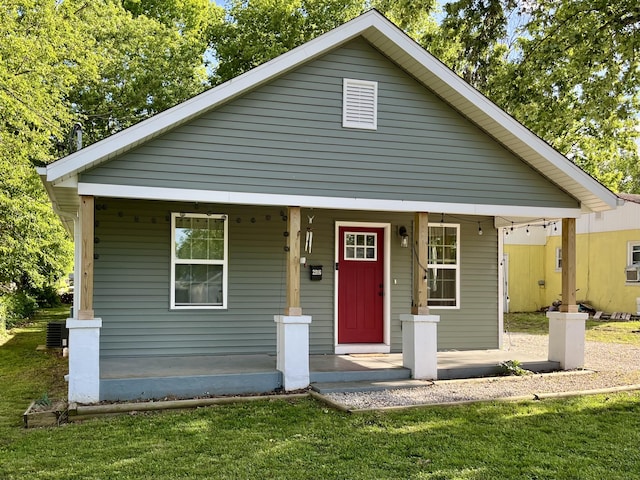 2016 W Olive St, Springfield, MO 65802 - bungalow-style house with a porch, a front lawn, and central AC unit