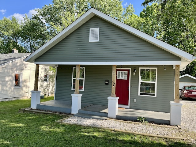 2016 W Olive St, Springfield, MO 65802 - bungalow-style home featuring a porch and a front lawn