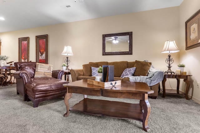 carpeted living room with a ceiling fan and baseboards