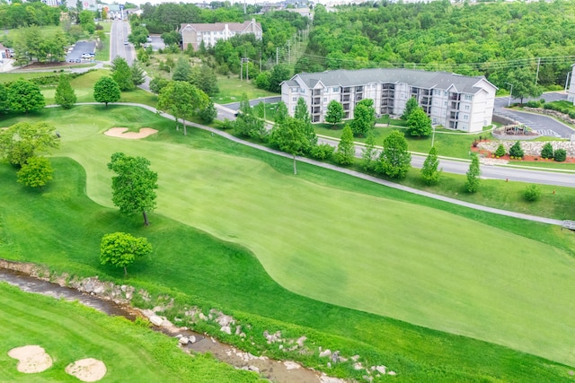aerial view of a golf course and apartment complex