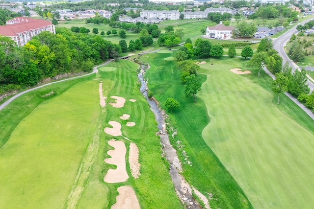 aerial view of property's location with a golf club