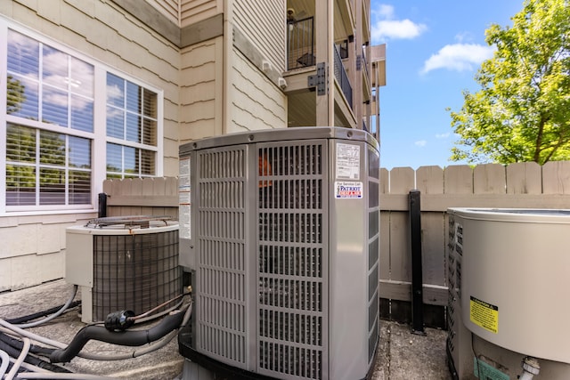 exterior view of cooling unit, fence, a power unit, and a gate