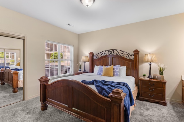 bedroom with carpet floors and baseboards