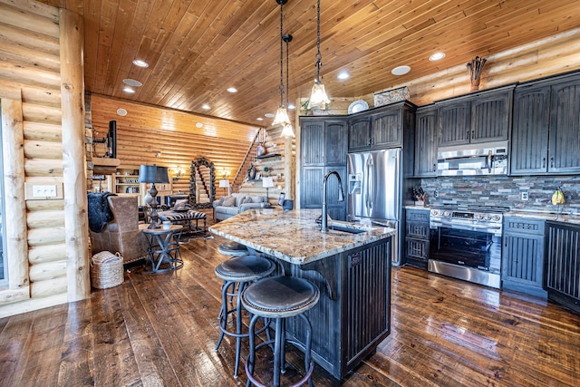 3701 S 1500th Rd, Rich Hill, MO 64779 - kitchen with rustic walls, appliances with stainless steel finishes, light stone countertops, dark wood-style floors, and wood ceiling