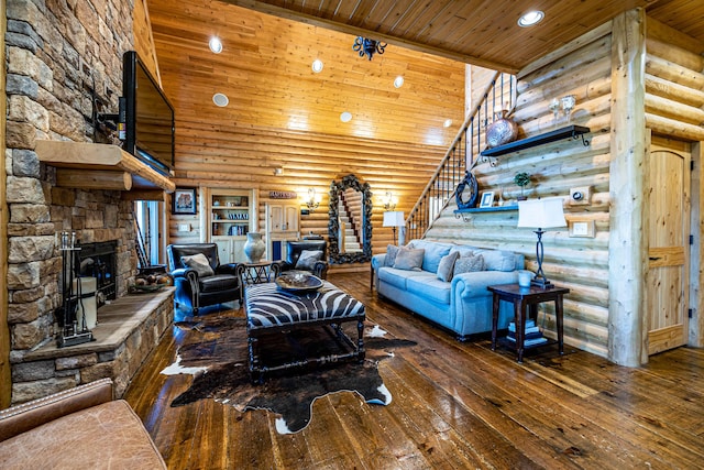 3701 S 1500th Rd, Rich Hill, MO 64779 - living room with log walls, stairs, wooden ceiling, a fireplace, and wood-type flooring