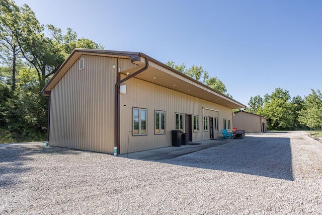 3701 S 1500th Rd, Rich Hill, MO 64779 - back of house with gravel driveway