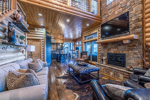 3701 S 1500th Rd, Rich Hill, MO 64779 - living room featuring hardwood / wood-style floors, a stone fireplace, recessed lighting, wood ceiling, and rustic walls