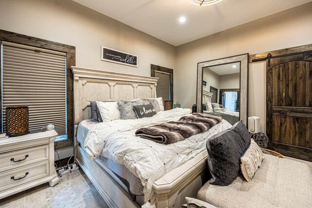 3701 S 1500th Rd, Rich Hill, MO 64779 - bedroom featuring recessed lighting, a barn door, and baseboards