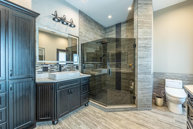3701 S 1500th Rd, Rich Hill, MO 64779 - bathroom featuring tile walls, vanity, a shower stall, toilet, and recessed lighting
