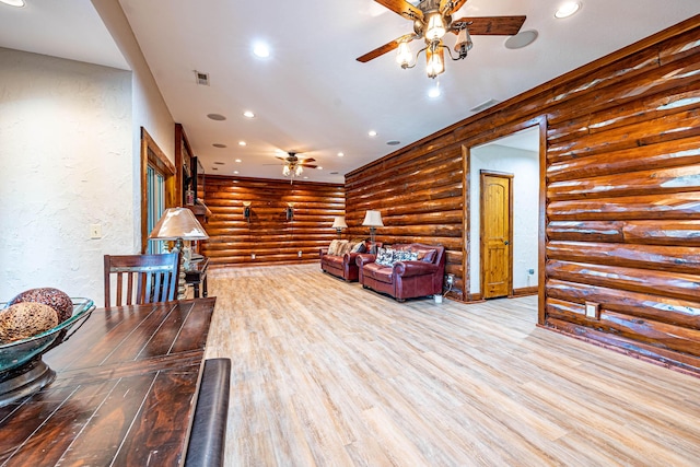 3701 S 1500th Rd, Rich Hill, MO 64779 - living room featuring a ceiling fan, rustic walls, wood finished floors, recessed lighting, and a textured wall