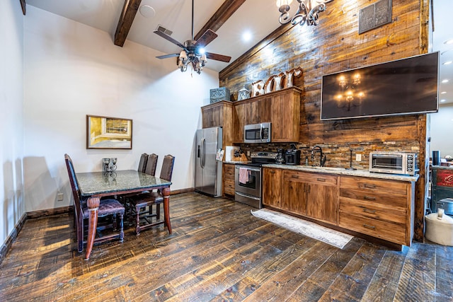 3701 S 1500th Rd, Rich Hill, MO 64779 - kitchen with stainless steel appliances, a ceiling fan, dark wood-style floors, beamed ceiling, and brown cabinetry