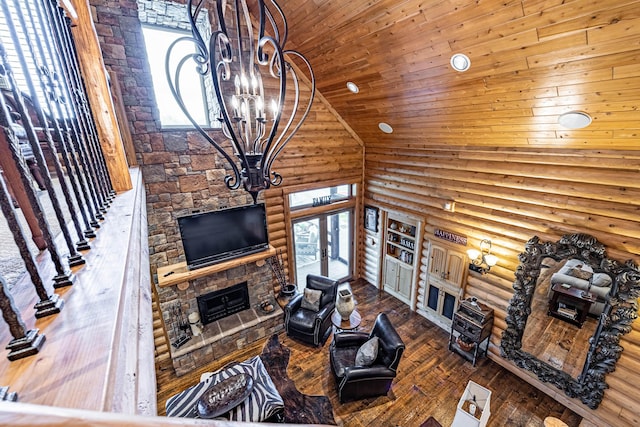 3701 S 1500th Rd, Rich Hill, MO 64779 - living area with high vaulted ceiling, log walls, a stone fireplace, french doors, and wooden ceiling