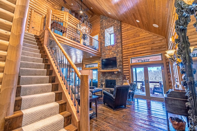 3701 S 1500th Rd, Rich Hill, MO 64779 - stairway with high vaulted ceiling, wooden ceiling, french doors, hardwood / wood-style flooring, and a stone fireplace