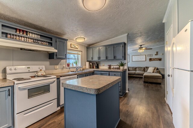 kitchen with white appliances, a sink, a center island, dark wood-style flooring, and a textured ceiling
